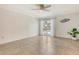 Spacious bedroom features tile floors, ceiling fan, and view to the pool and backyard at 4712 Glenbrooke Dr, Sarasota, FL 34243