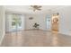 Spacious bedroom features tiled floor, ceiling fan, slider to pool, and ensuite bathroom at 4712 Glenbrooke Dr, Sarasota, FL 34243