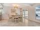 Bright dining room with a view, featuring sliding glass doors and stylish decor, ideal for entertaining at 4712 Glenbrooke Dr, Sarasota, FL 34243