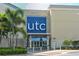 Retail entrance with palm trees and prominent 'utc' signage, enhancing shopping experience at 4712 Glenbrooke Dr, Sarasota, FL 34243