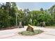 Gated community entrance displaying well-maintained landscaping and a secure, welcoming environment at 4712 Glenbrooke Dr, Sarasota, FL 34243