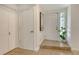 Inviting entryway with tile floors, coat closet, and white front door with sidelight, creating a bright and welcoming space at 4712 Glenbrooke Dr, Sarasota, FL 34243