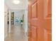 Bright foyer featuring tile flooring, a fireplace, and a glimpse of the living space beyond at 4712 Glenbrooke Dr, Sarasota, FL 34243