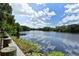 Expansive lake view showcasing lush greenery and a tranquil waterfront setting at 4712 Glenbrooke Dr, Sarasota, FL 34243