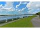 The scenic view of a walking path beside the lake in the park offers an inviting outdoor experience for visitors at 4712 Glenbrooke Dr, Sarasota, FL 34243