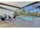 Screened pool with lounge chairs and lush tropical landscaping at 4712 Glenbrooke Dr, Sarasota, FL 34243