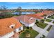 A beautiful house with a terracotta tiled roof and a well-maintained yard at 4811 Summertree Rd, Venice, FL 34293
