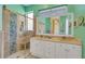 Modern bathroom with glass shower, dual vanity sinks, and stylish tiled walls at 4811 Summertree Rd, Venice, FL 34293