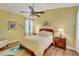 Comfortable bedroom with a ceiling fan and en-suite bathroom at 4811 Summertree Rd, Venice, FL 34293