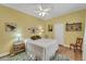 Comfortable bedroom with a bed, colorful rug, and natural light from the window at 4811 Summertree Rd, Venice, FL 34293
