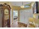Inviting foyer with neutral walls, wood flooring and view into the adjacent living room at 4811 Summertree Rd, Venice, FL 34293