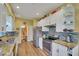 Bright kitchen with granite countertops, stainless steel appliances, and ample cabinet space at 4811 Summertree Rd, Venice, FL 34293