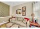 Comfortable living room with a sofa, decorative pillows, and tasteful artwork on the walls at 4811 Summertree Rd, Venice, FL 34293