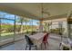 Screened patio featuring a ceiling fan, colorful lights, table and seating at 4811 Summertree Rd, Venice, FL 34293