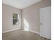 Comfortable bedroom with wood floors, a bright window, and neutral walls at 5 Debrita Rd, North Port, FL 34291