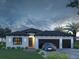 Charming one-story home with well manicured lawn and a three car garage at 5 Debrita Rd, North Port, FL 34291