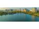 Waterfront view of a city skyline, showcasing the beautiful bay and the tall buildings at 512 Laurel Park Dr, Sarasota, FL 34236