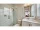 Bright bathroom features a glass enclosed shower, white marble tiling, and a granite countertop at 512 Laurel Park Dr, Sarasota, FL 34236