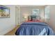 This bedroom features a full bed, light walls, a bedside table, and natural lighting at 512 Laurel Park Dr, Sarasota, FL 34236