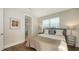Comfortable bedroom with stylish decor, natural light, and an ensuite bathroom with a glass shower at 512 Laurel Park Dr, Sarasota, FL 34236