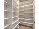 Spacious walk-in closet with custom shelving, perfect for organized storage at 512 Laurel Park Dr, Sarasota, FL 34236