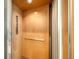 Private elevator featuring light wood paneling, illuminated ceiling, and easy access buttons at 512 Laurel Park Dr, Sarasota, FL 34236