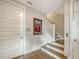 Welcoming foyer with hardwood floors, staircase, and elegant decor at 512 Laurel Park Dr, Sarasota, FL 34236
