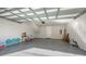 Spacious garage featuring finished walls, ceiling, and flooring, with an automatic door at 512 Laurel Park Dr, Sarasota, FL 34236
