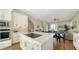 Well-appointed kitchen with stainless steel appliances, a center island, and seamless flow to the living space at 512 Laurel Park Dr, Sarasota, FL 34236