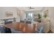 Bright living room and dining area with stylish furnishings and a modern ceiling fan at 512 Laurel Park Dr, Sarasota, FL 34236