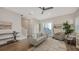 Comfortable living room featuring hardwood floors, staircase access, and abundant natural light at 512 Laurel Park Dr, Sarasota, FL 34236