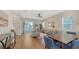 Spacious living room and dining area featuring hardwood floors and lots of natural light at 512 Laurel Park Dr, Sarasota, FL 34236