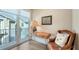 Office space with a modern desk, reading chair, and balcony with natural light at 512 Laurel Park Dr, Sarasota, FL 34236