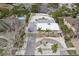 Aerial view of property showcasing pool, lush landscaping, and close proximity to the water at 55 N Washington Dr, Sarasota, FL 34236