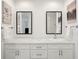 Bathroom featuring double sinks with modern fixtures and marble countertop at 55 N Washington Dr, Sarasota, FL 34236