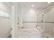 Bathroom with a bathtub with shower head and tiled walls at 55 N Washington Dr, Sarasota, FL 34236