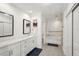 Bright bathroom with a soaking tub, vanity, and framed mirrors at 55 N Washington Dr, Sarasota, FL 34236
