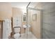Compact bathroom featuring a toilet, vanity, and a standing shower with glass doors at 55 N Washington Dr, Sarasota, FL 34236