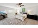 Inviting bedroom with neutral tones, a plush rug, and a ceiling fan for added comfort at 55 N Washington Dr, Sarasota, FL 34236