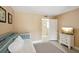 Inviting bedroom with a daybed, warm neutral walls, and a TV for relaxing evenings at 55 N Washington Dr, Sarasota, FL 34236