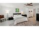 Well-lit bedroom with ensuite bathroom offers privacy and convenience with modern furniture and décor at 55 N Washington Dr, Sarasota, FL 34236