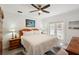Bedroom featuring a ceiling fan, french doors, and neutral color palette at 55 N Washington Dr, Sarasota, FL 34236