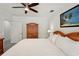 Bedroom featuring a ceiling fan, wood furniture, and neutral color palette at 55 N Washington Dr, Sarasota, FL 34236