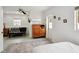 Bedroom with a futon and wardrobe next to a doorway in a brightly lit space at 55 N Washington Dr, Sarasota, FL 34236