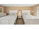 Bedroom featuring two beds, a night stand, and a dresser at 55 N Washington Dr, Sarasota, FL 34236