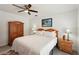 Bedroom featuring a ceiling fan, wood furniture, and neutral color palette at 55 N Washington Dr, Sarasota, FL 34236