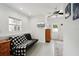 Bonus room featuring a futon, area rug, natural light, and a ceiling fan for comfortable living at 55 N Washington Dr, Sarasota, FL 34236