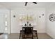 Cozy breakfast nook featuring a small table with seating for two, a window, and modern decor at 55 N Washington Dr, Sarasota, FL 34236