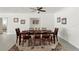 Dining room with seating for six, a decorative rug, and beach-themed decor at 55 N Washington Dr, Sarasota, FL 34236