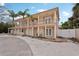 Beautiful two-story home with a welcoming balcony and a well-manicured lawn at 55 N Washington Dr, Sarasota, FL 34236
